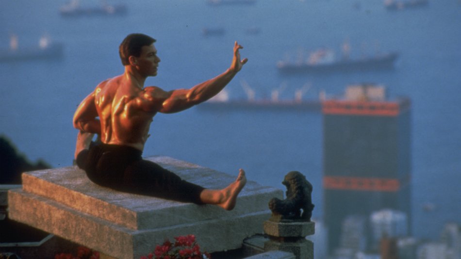 Van Damme performing his famous splits on a building